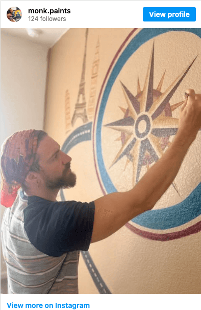 monk.paints Instagram post — painting a compass mural